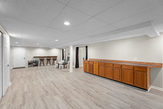 a room with wooden floors and furniture