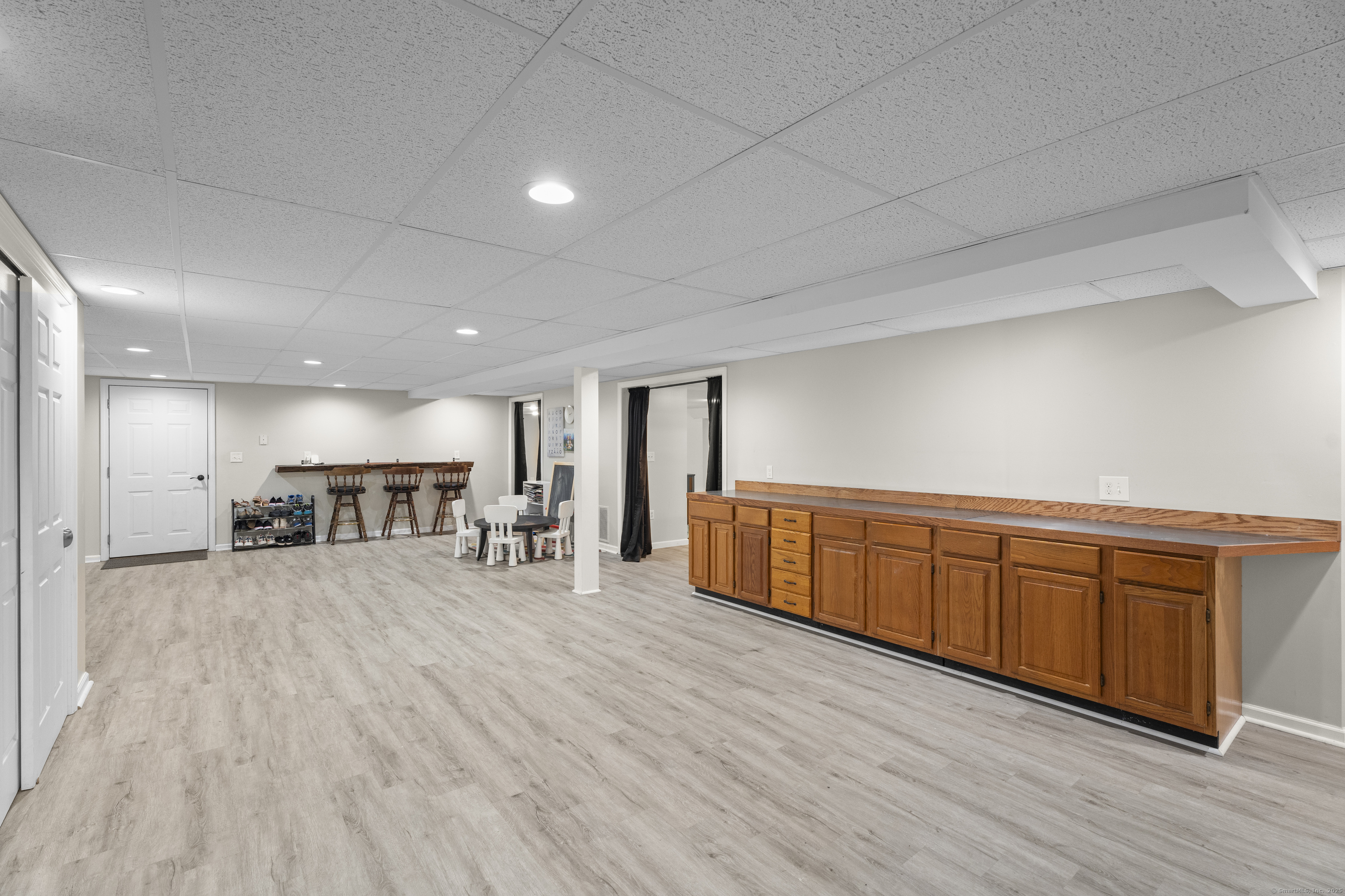 305 Killorin Road Watertown, CT 06795 - Photo 28 of 40 a room with wooden floors and furniture