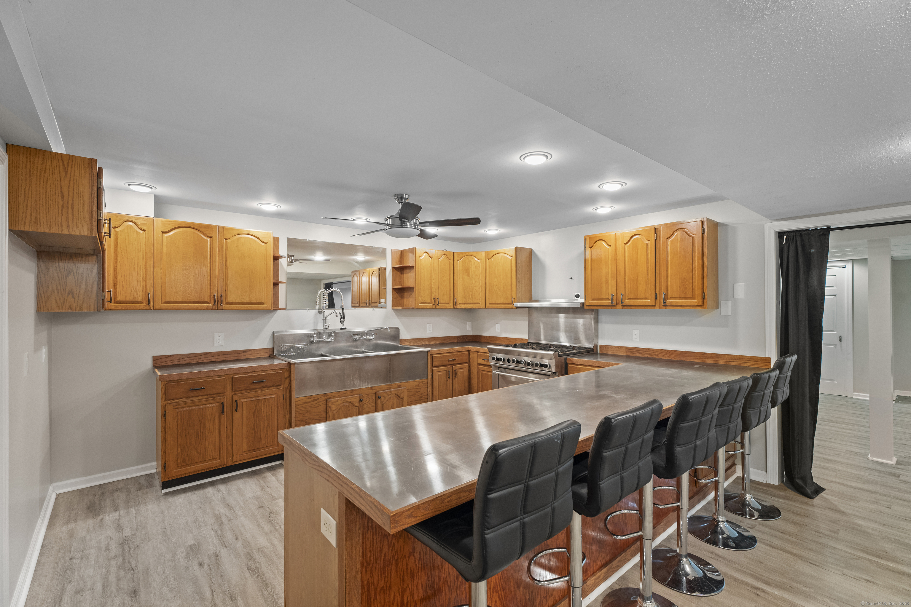 305 Killorin Road Watertown, CT 06795 - Photo 32 of 40 a large kitchen with granite countertop a large counter top space and stainless steel appliances