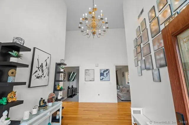 a view of a bedroom with workspace and natural light
