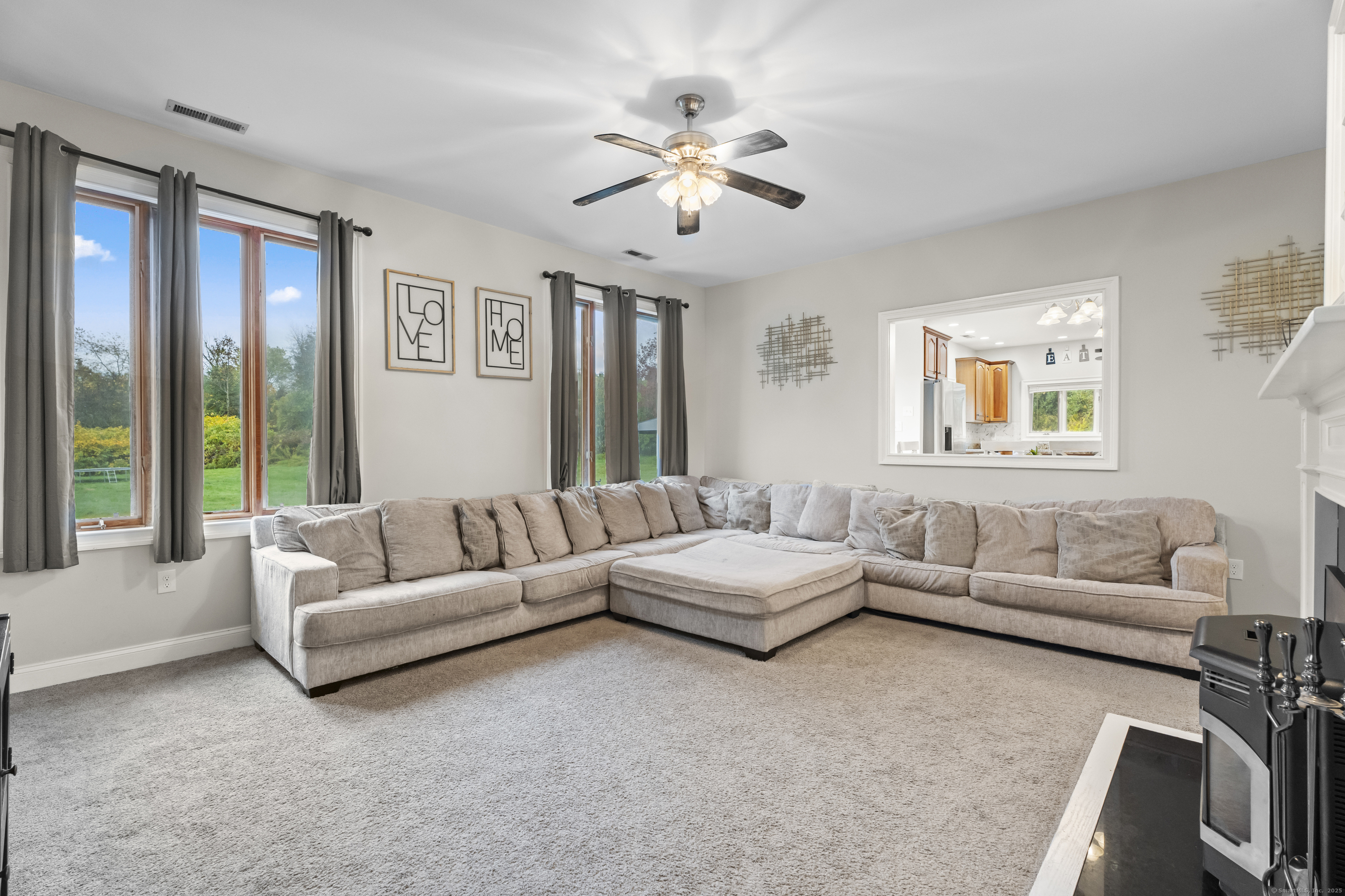 305 Killorin Road Watertown, CT 06795 - Photo 7 of 40 a living room with furniture and a large window