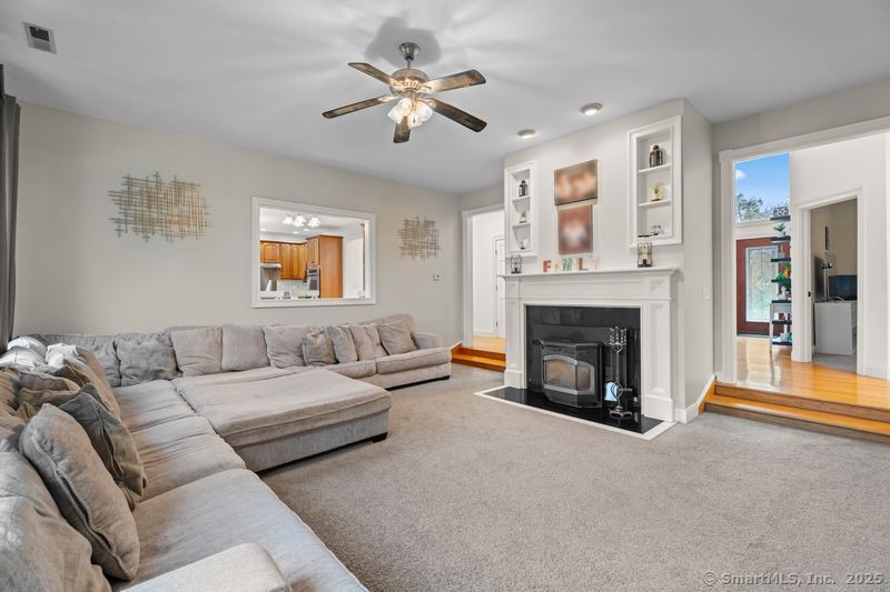 305 Killorin Road Watertown, CT 06795 - Photo 8 of 40 a living room with furniture and a fireplace