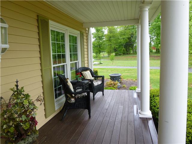 8476 Cedar Grove Road Cross Plains, TN 37049 - Photo 5 of 20 a house view with a seating space and garden view