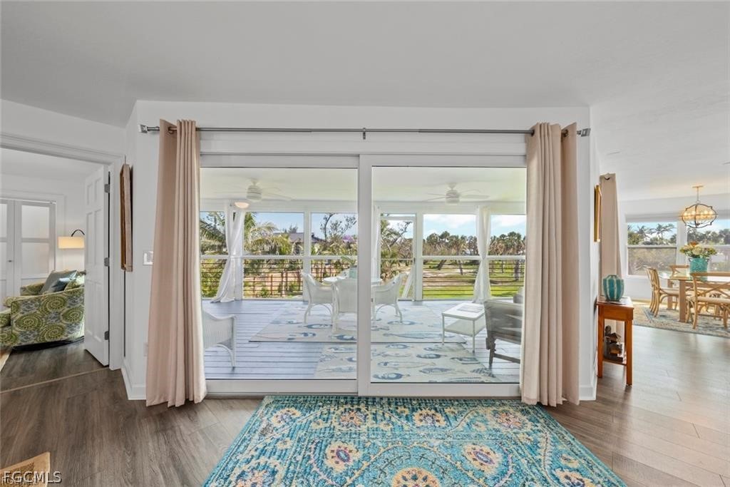 6093 Henderson Road Sanibel, FL 33957 - Photo 11 of 49 a view of front door with wooden floor