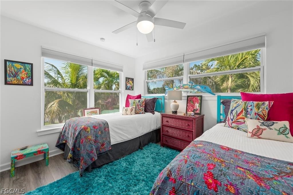 6093 Henderson Road Sanibel, FL 33957 - Photo 28 of 49 a bed room with a bed and a window