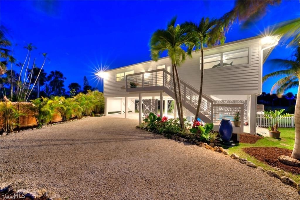 6093 Henderson Road Sanibel, FL 33957 - Photo 33 of 49 a view of a building with a yard