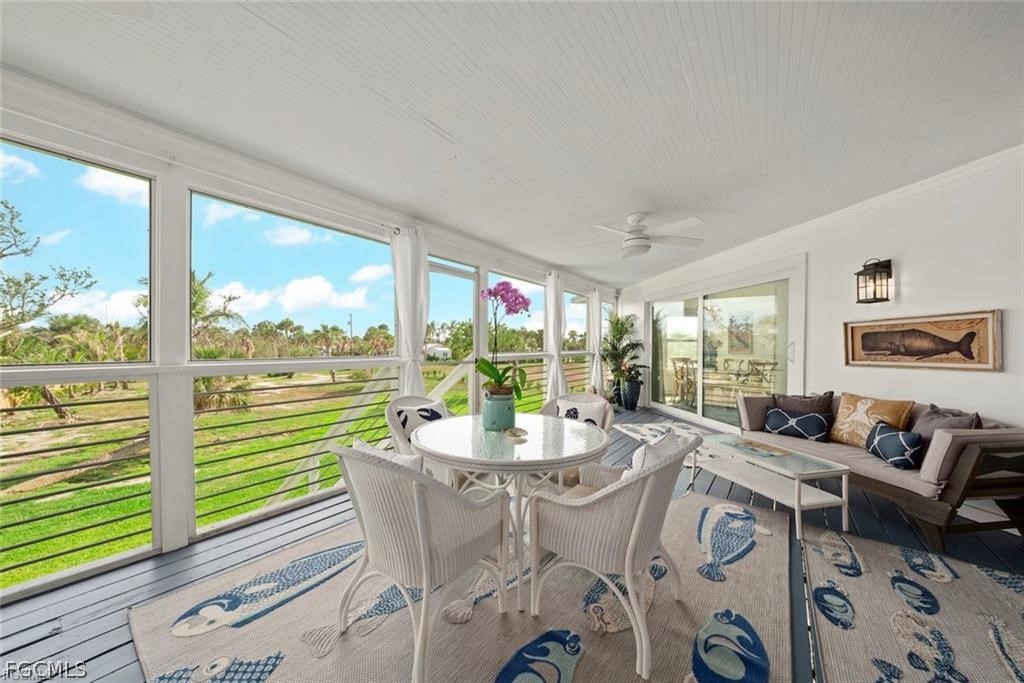6093 Henderson Road Sanibel, FL 33957 - Photo 39 of 49 a dining room with furniture window and outside view
