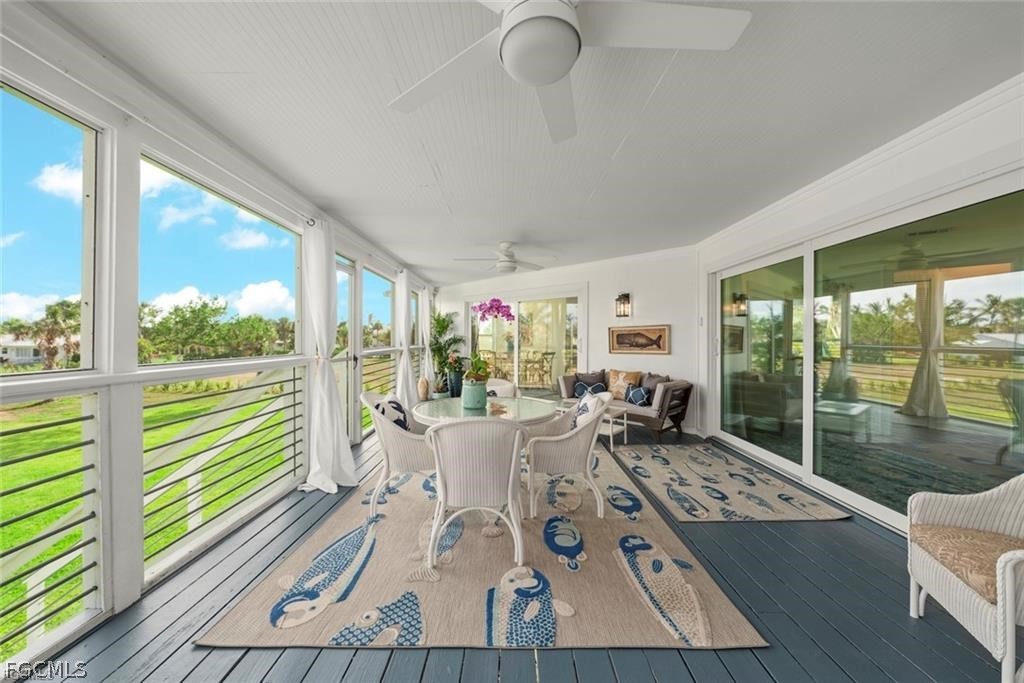 6093 Henderson Road Sanibel, FL 33957 - Photo 40 of 49 a living room with furniture and large windows