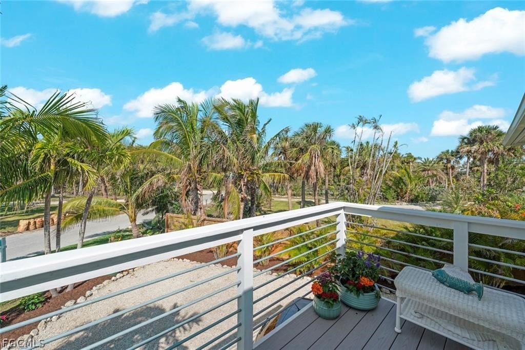 6093 Henderson Road Sanibel, FL 33957 - Photo 5 of 49 a view of a balcony with wooden floor and outdoor space