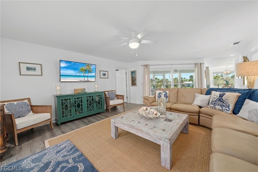 6093 Henderson Road Sanibel, FL 33957 - Photo 8 of 49 a living room with furniture and a table