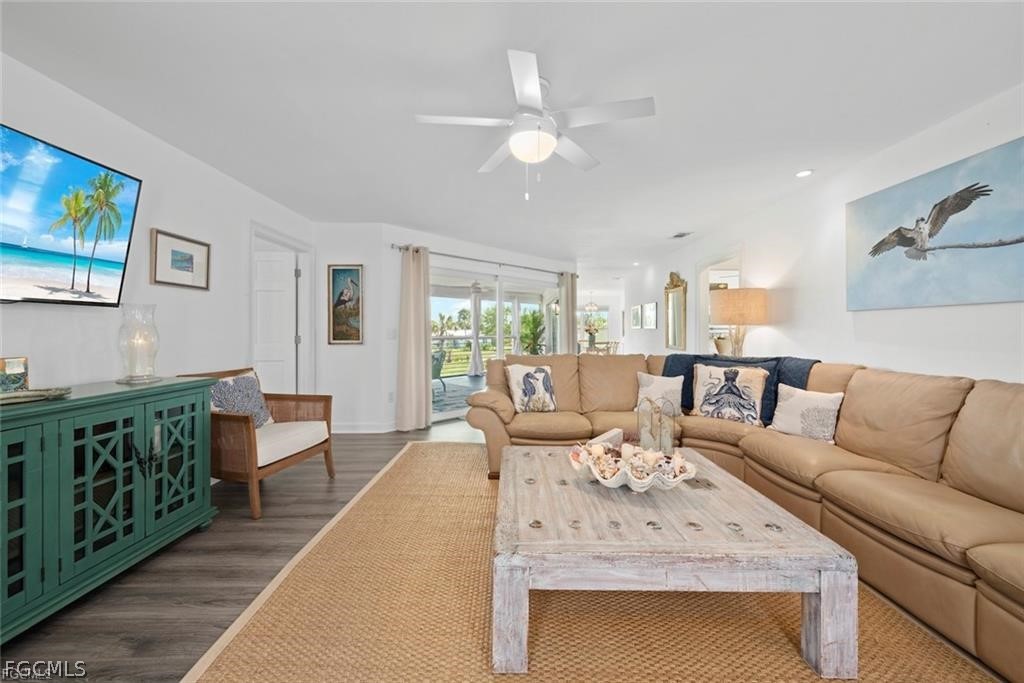 6093 Henderson Road Sanibel, FL 33957 - Photo 9 of 49 a living room with furniture and a fireplace