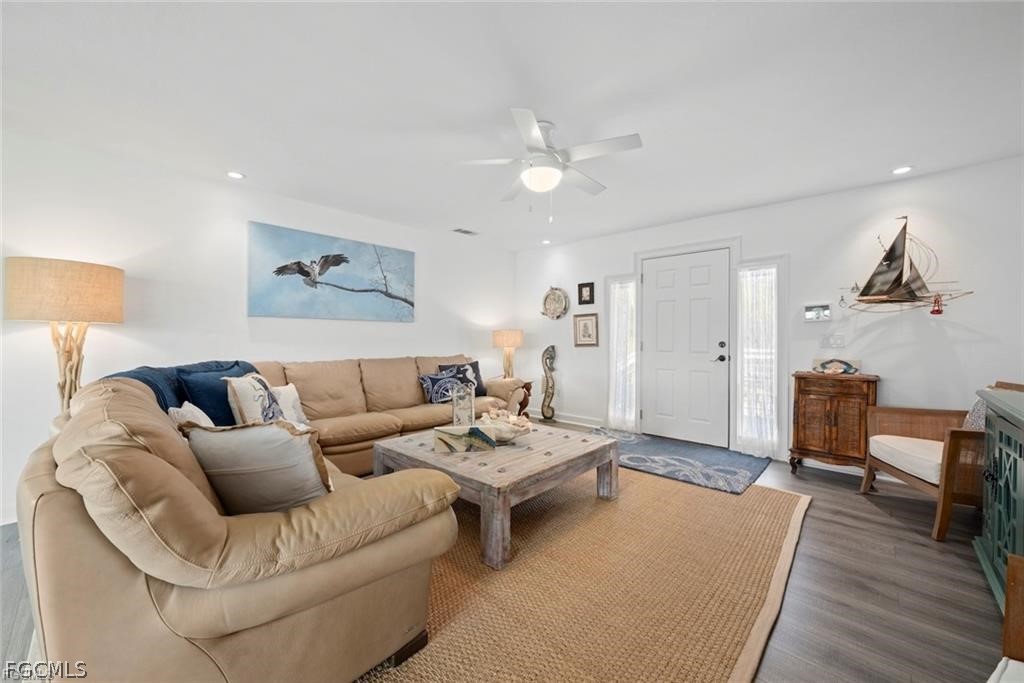 6093 Henderson Road Sanibel, FL 33957 - Photo 10 of 49 a living room with furniture and wooden floor