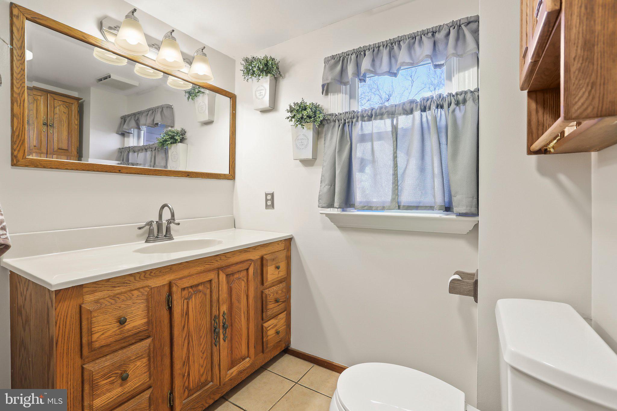 592 Chatsworth Road Tabernacle, NJ 08088 - Photo 18 of 32 a bathroom with a granite countertop sink mirror vanity and toilet