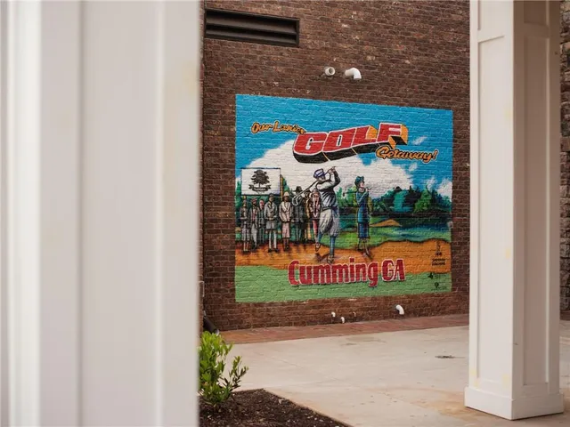 an aerial view of a house with a lake view
