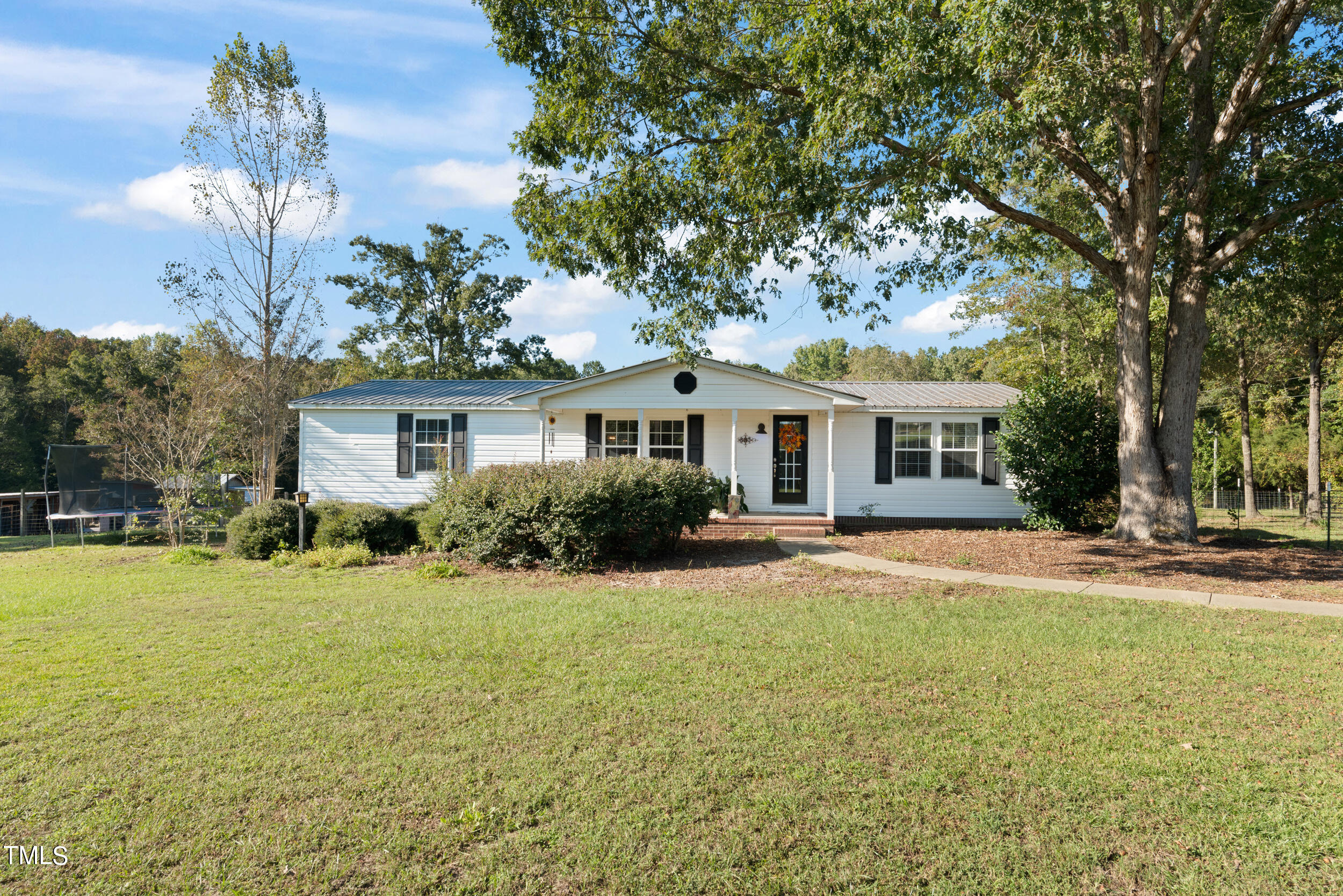 337 Horne Estate Road Carthage, NC 28327 - Photo 1 of 51 a front view of a house with a yard and garage