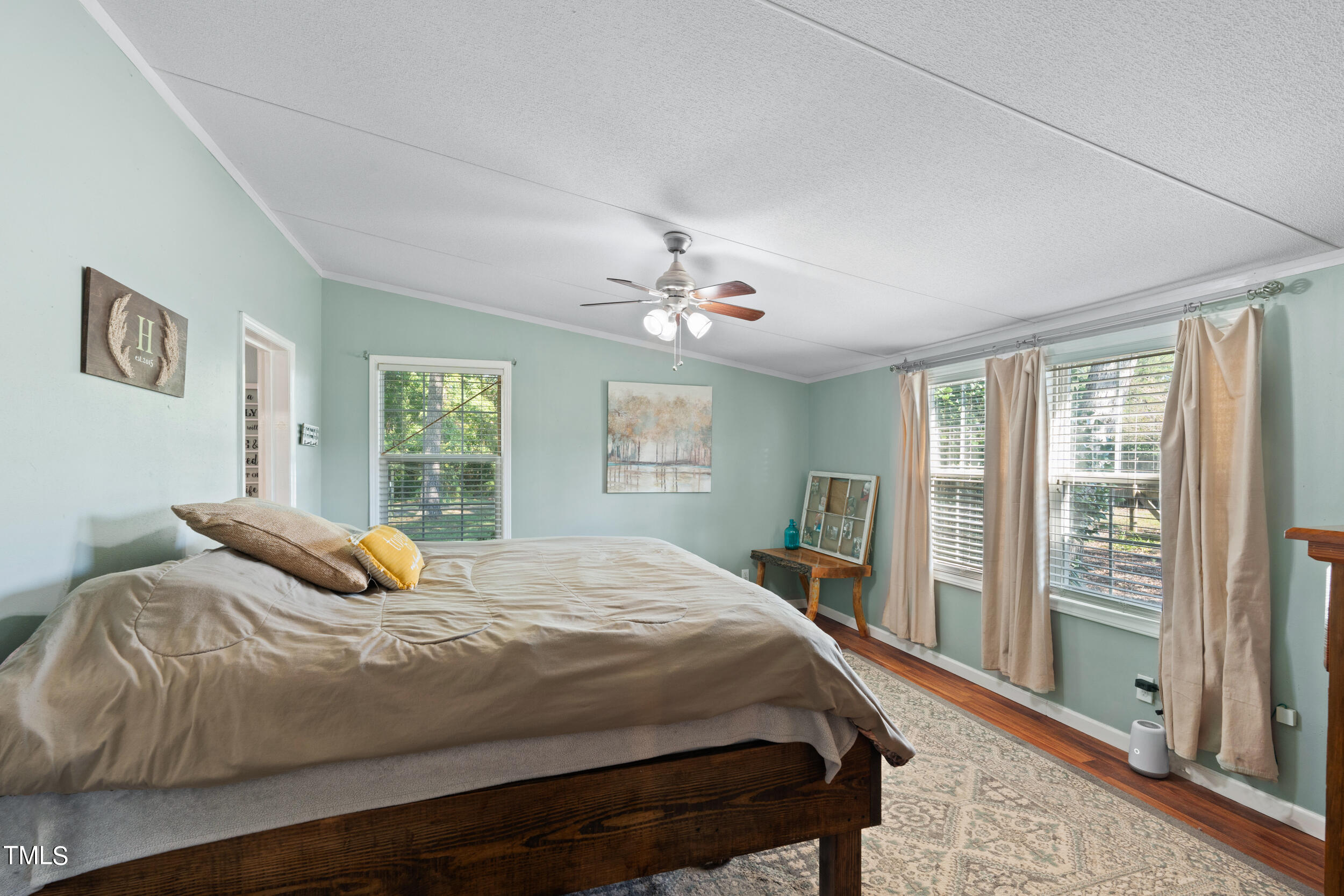 337 Horne Estate Road Carthage, NC 28327 - Photo 17 of 51 a bedroom with a large bed and a window
