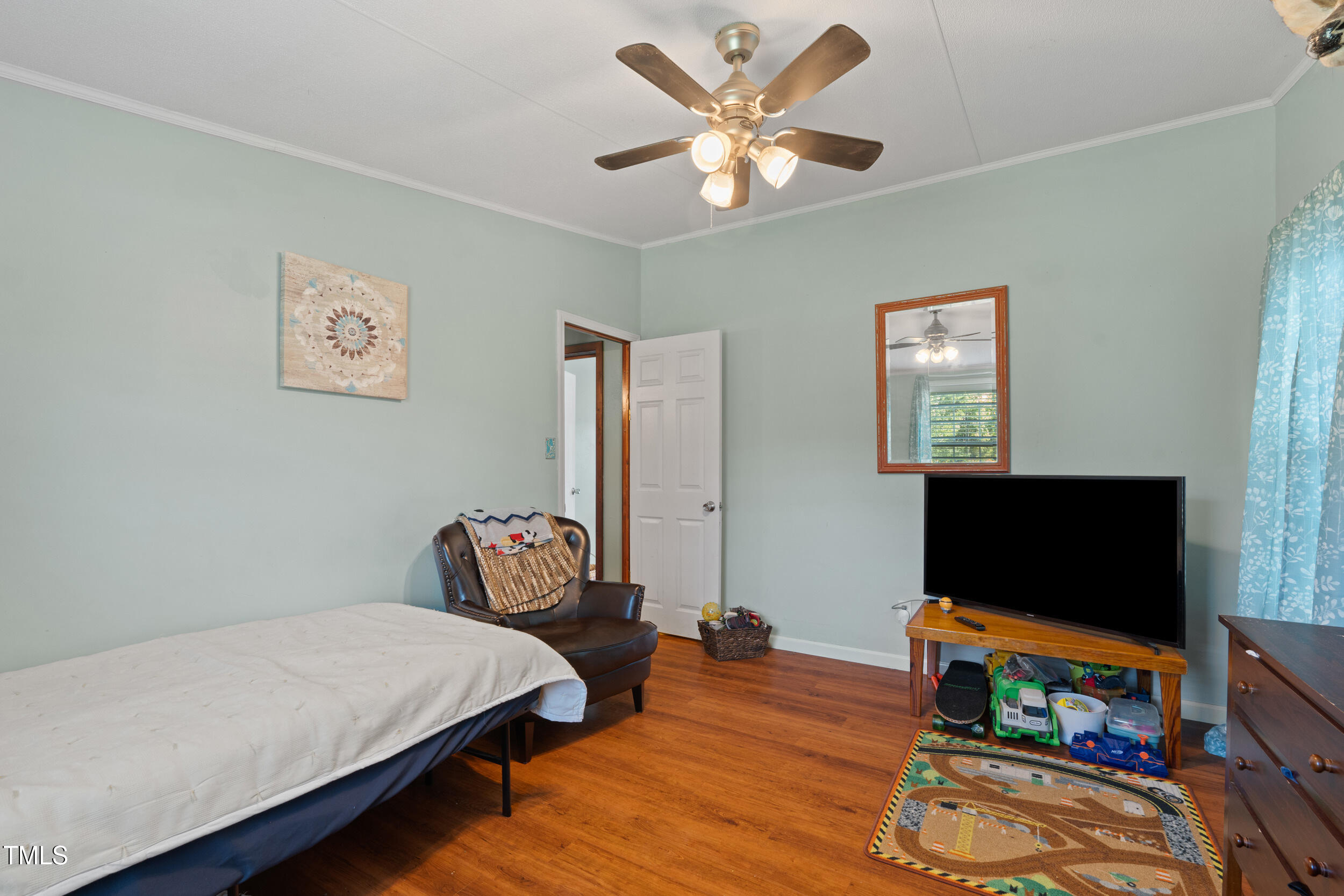 337 Horne Estate Road Carthage, NC 28327 - Photo 21 of 51 a bedroom with a bed and a flat screen tv