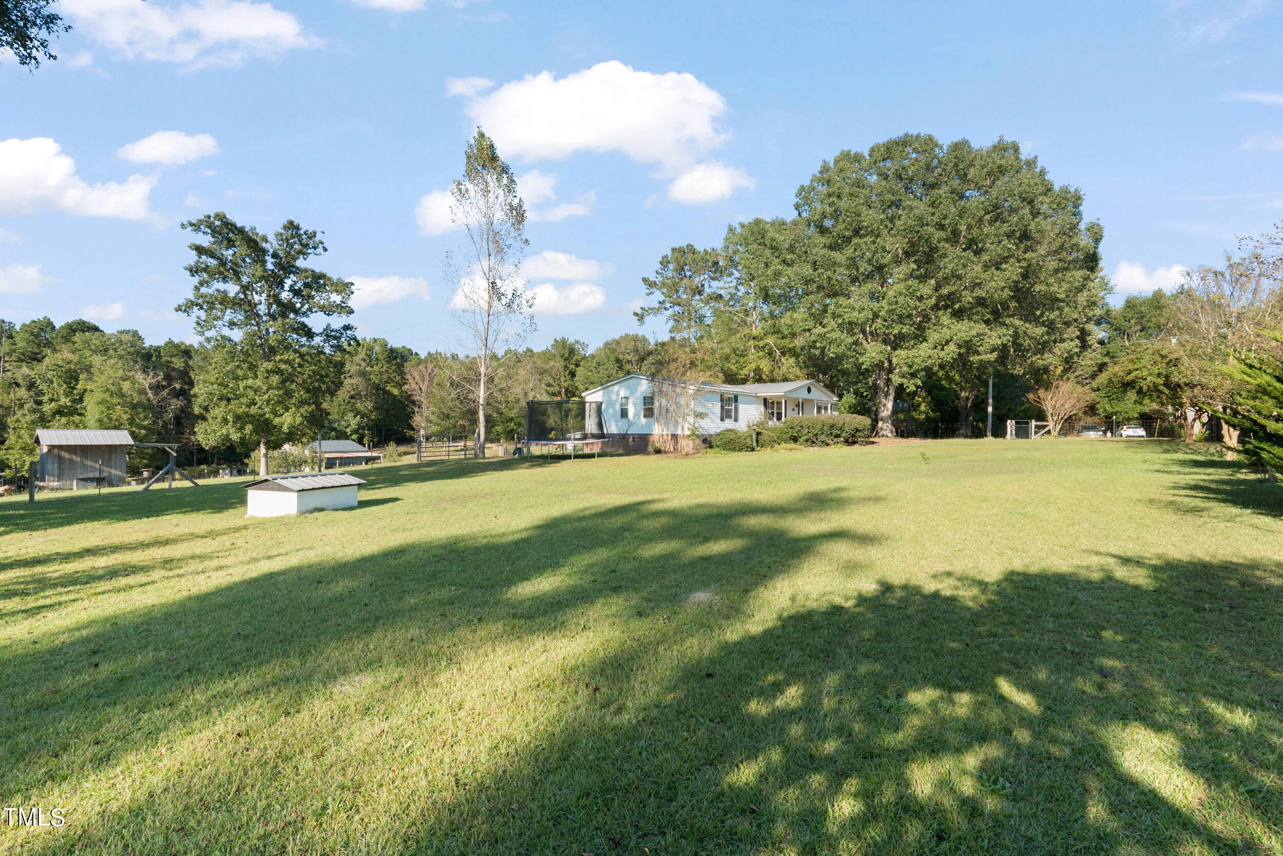 337 Horne Estate Road Carthage, NC 28327 - Photo 25 of 51 a view of a fountain in front of a house with a big yard