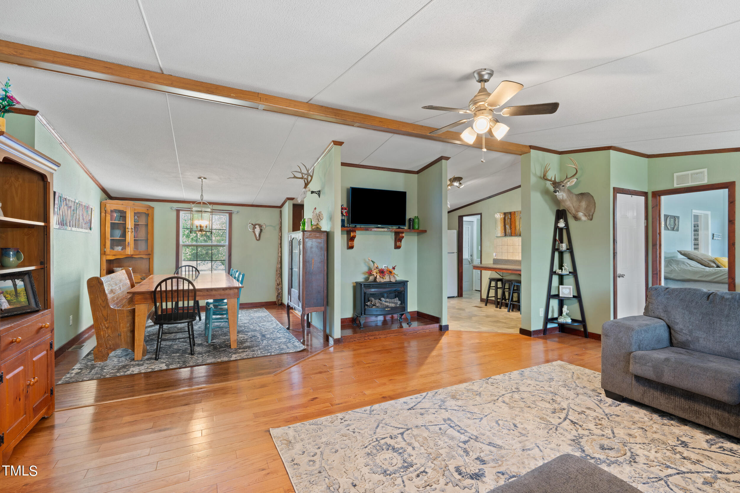 337 Horne Estate Road Carthage, NC 28327 - Photo 6 of 51 a living room with furniture dining table and a fireplace