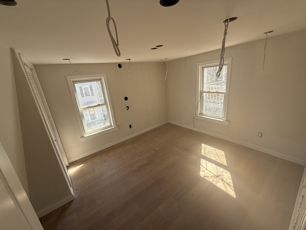 28 Angell Street Mansfield, MA 02048 - Photo 13 of 17 a view of an empty room with a window