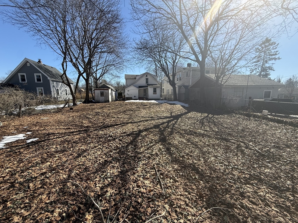 28 Angell Street Mansfield, MA 02048 - Photo 4 of 17 a backyard of a house with large trees