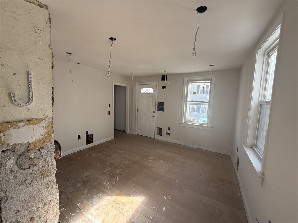 28 Angell Street Mansfield, MA 02048 - Photo 8 of 17 a view of a room with window and ceiling fan