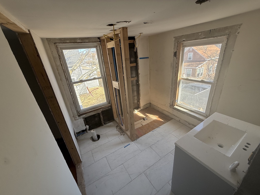 28 Angell Street Mansfield, MA 02048 - Photo 10 of 17 wooden floor and window in a room