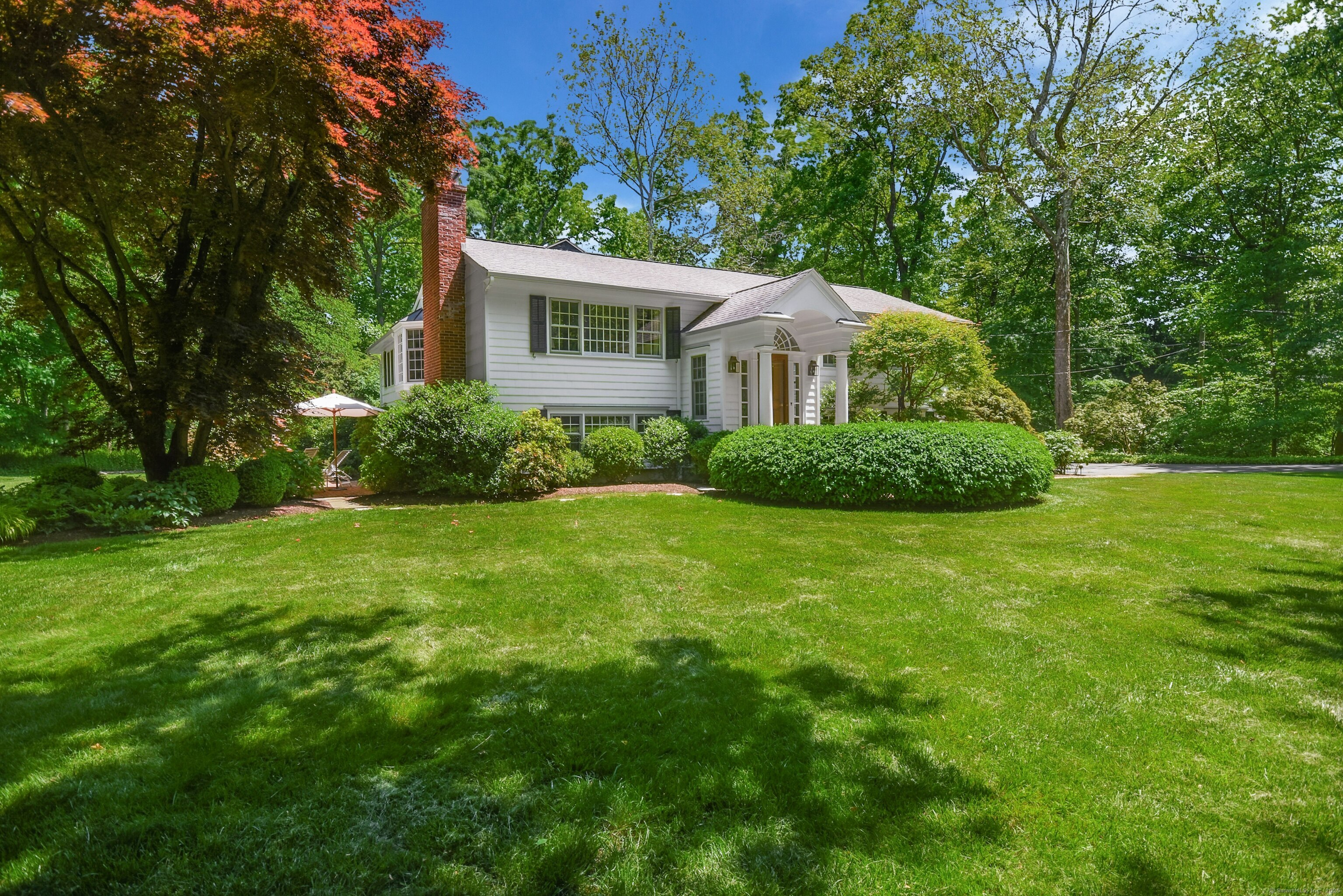 26 Silver Ridge Road Norwalk, CT 06850 - Photo 1 of 1 a front view of a house with a garden