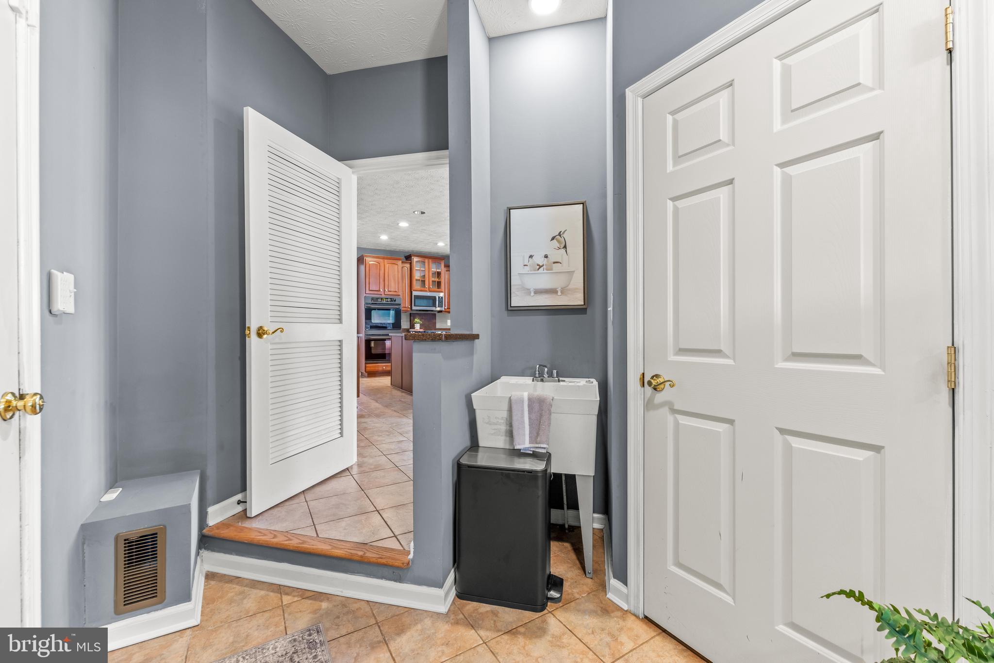 1717 Maco Drive Hanover, MD 21076 - Photo 37 of 93 a living room with furniture and a fireplace