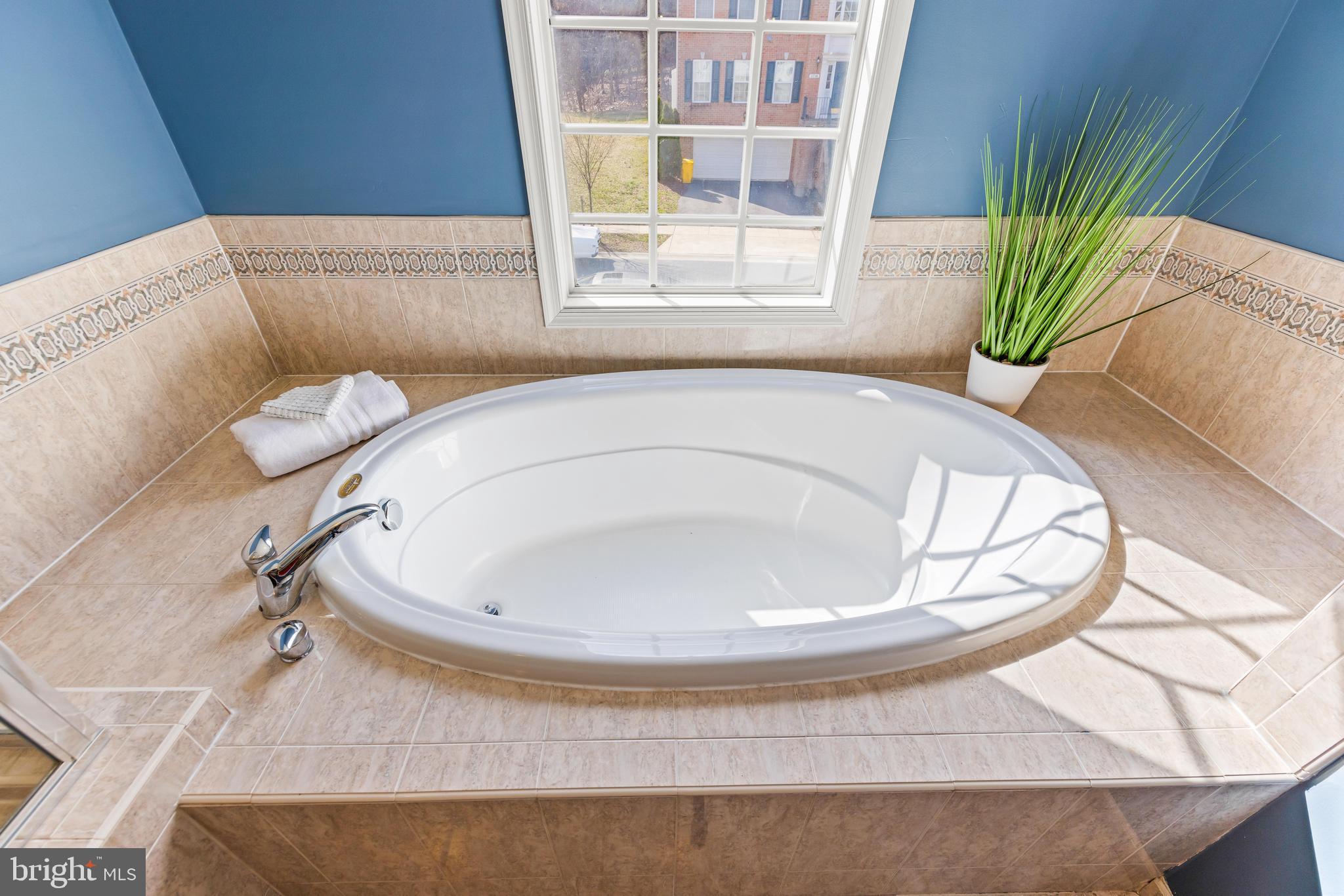 1717 Maco Drive Hanover, MD 21076 - Photo 52 of 93 a white bath tub sitting in a bathroom next to a window