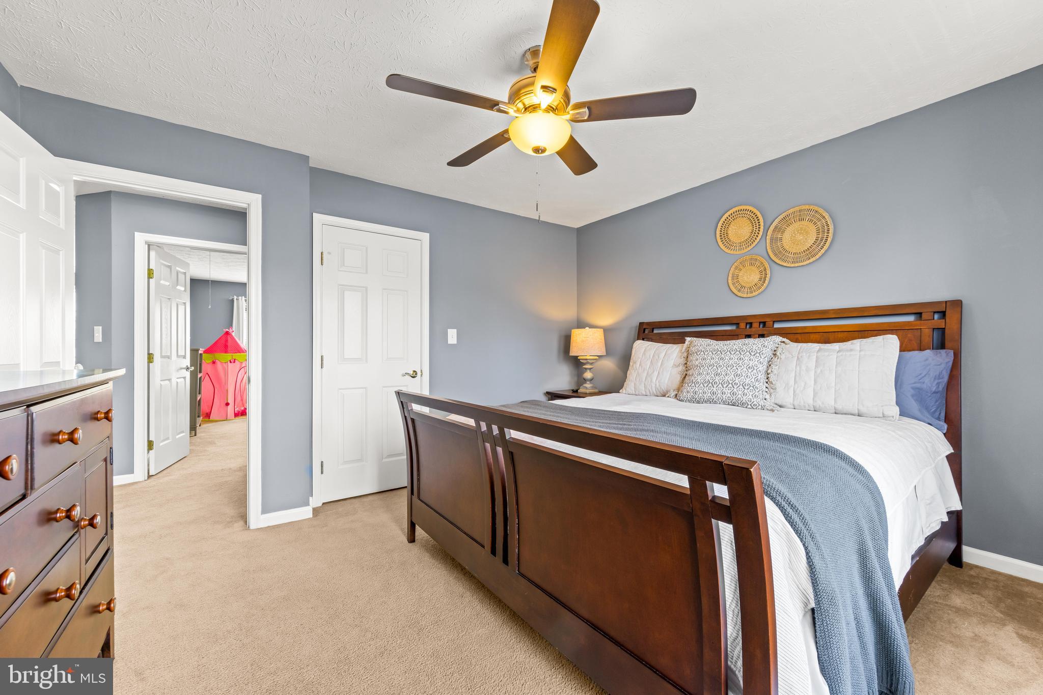 1717 Maco Drive Hanover, MD 21076 - Photo 57 of 93 a bedroom with a bed and a chandelier