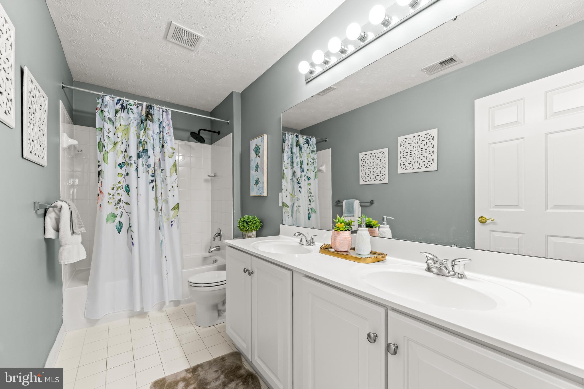 1717 Maco Drive Hanover, MD 21076 - Photo 58 of 93 a bathroom with a sink a toilet and shower