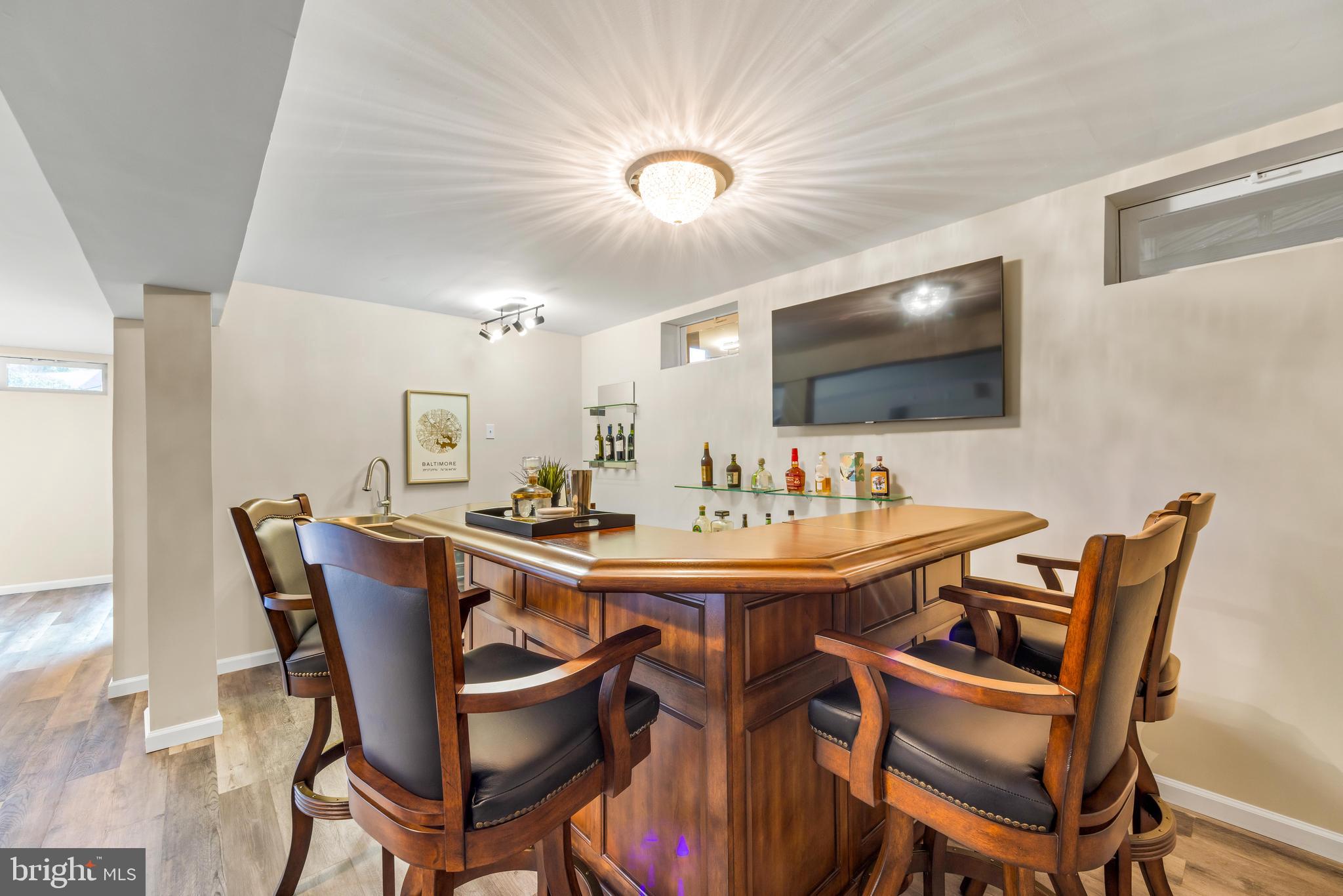 1717 Maco Drive Hanover, MD 21076 - Photo 69 of 93 a view of a dining room with furniture and wooden floor
