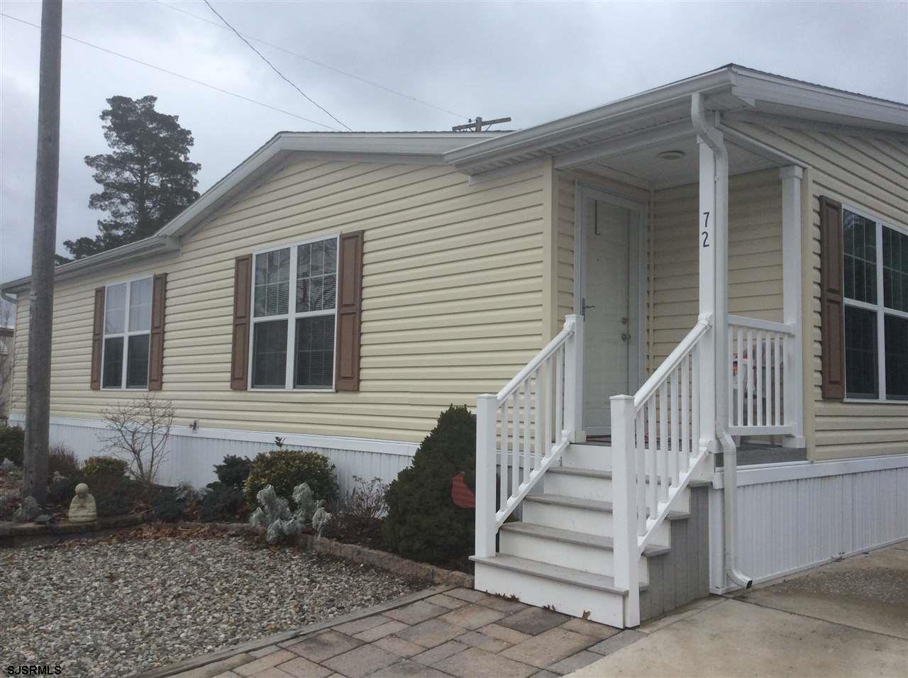 72 Barrington Road Marmora, NJ 08223 - Photo 1 of 1 a front view of a house with a yard