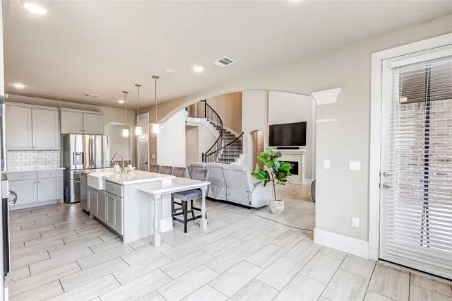a kitchen with a table and chairs in it