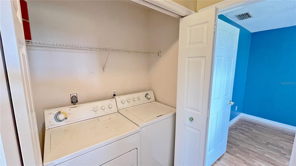 427 Eagle Ridge Drive Davenport, FL 33837 - Photo 11 of 39 a utility room with dryer and washer