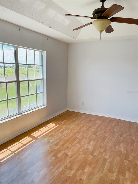 427 Eagle Ridge Drive Davenport, FL 33837 - Photo 12 of 39 a view of a room with a window and a ceiling fan