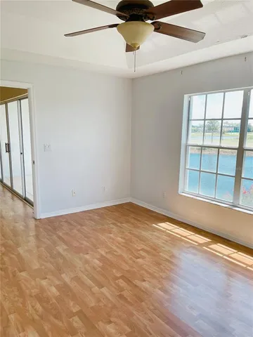 a view of a room with kitchen and a window