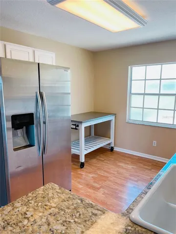 a bathroom with a shower and a sink