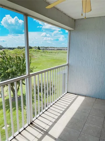 a view of a room with wooden floor and chair
