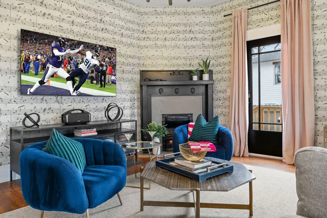 a living room with furniture and a fireplace