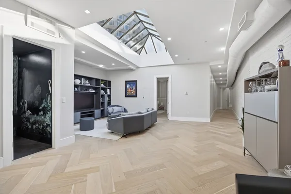 a view of kitchen with refrigerator and window