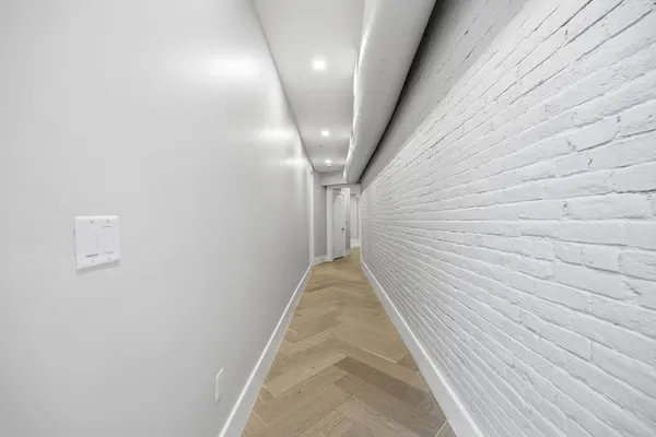 a room with a bed and glass table