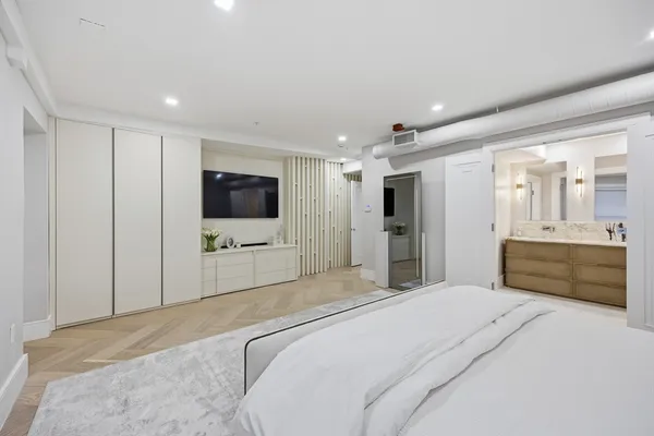 a bathroom with a double vanity sink mirror and shower