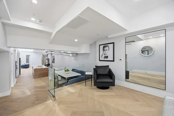a bedroom with furniture and a glass door