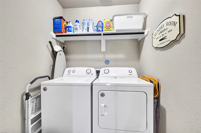 a utility room with dryer and washer