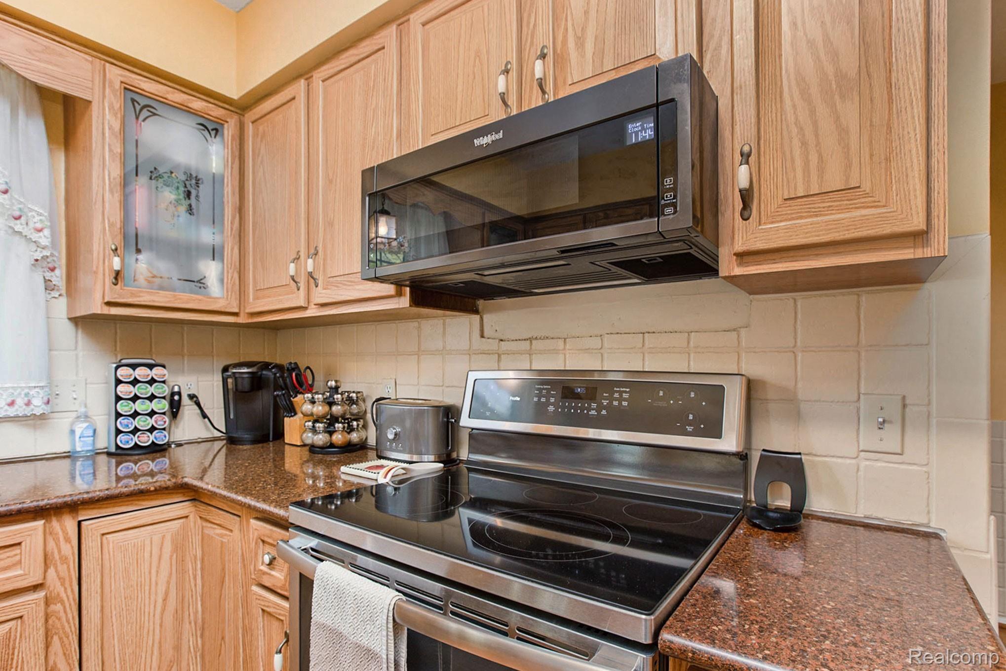 9500 Gibbs Road Clarkston, MI 48348 - Photo 9 of 30 Dishwasher, stove and microwave 2019