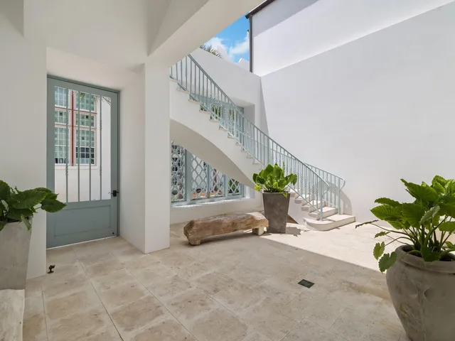 a view of entryway with flower pots