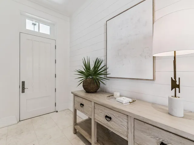 a living room with couches and a flat screen tv
