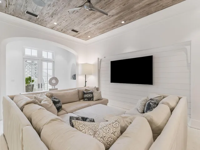 a living room with furniture kitchen view and a fireplace